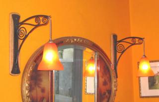 Set of 4 French wall sconces in "Fer Forgé".